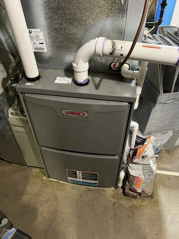 Lennox gas furnace in a residential basement setting.